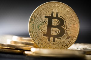 Bitcoins sind die neue hei&szlig;e Investitionsm&ouml;glichkeit. Aber wer hat den Bitcoin eigentlich erfunden? fotolia.de &copy;REDPIXEL (#174961685)